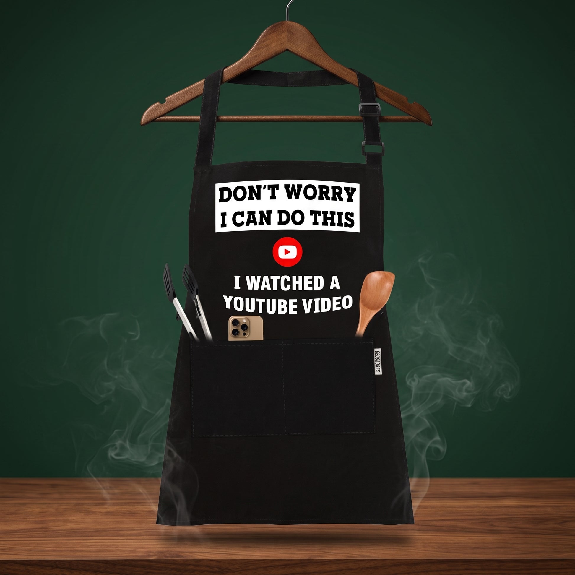 Pitmaster General pocket grill apron on a wooden hanger, Big Ron BBQ catalog